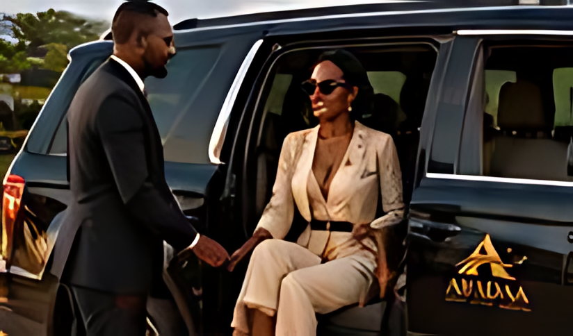 An ABADAA host opening the door of a liveried SUV for a guest